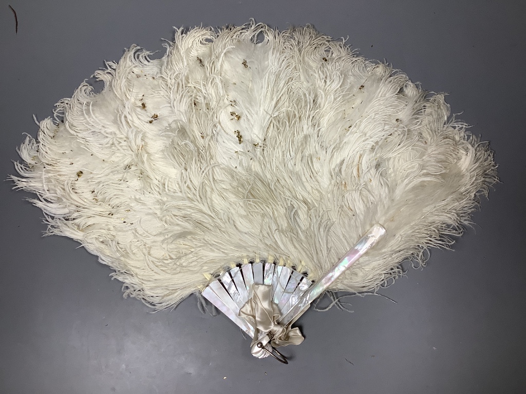 A collection of four various feather fans